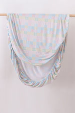 Pink floral checkered bamboo crib sheet