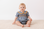 Navy floral smocked ruffle bubble