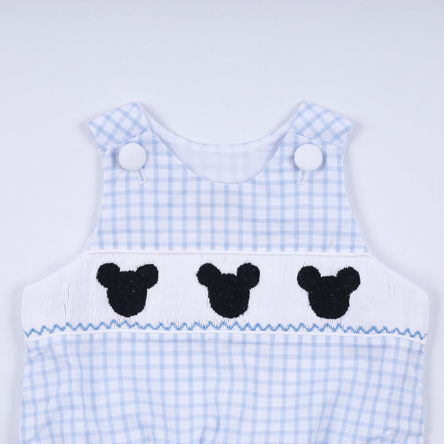 Blue character hand smocked gingham bubble